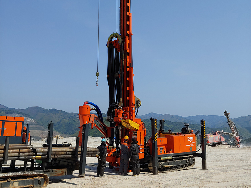 Orange Hanjin D&B-30Multi tracked drilling rig working in the field